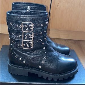 Black leather riding boots with silver studs.